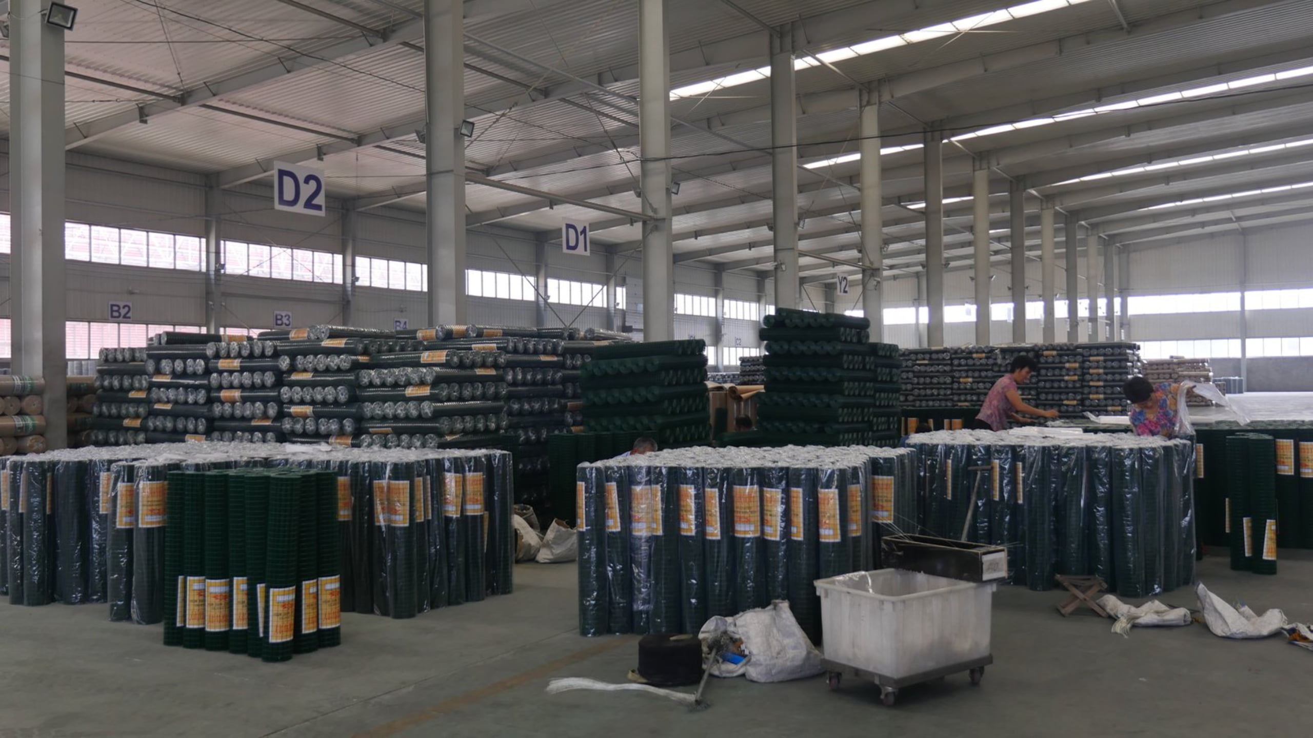 Factory aisle with large wire mesh inventory